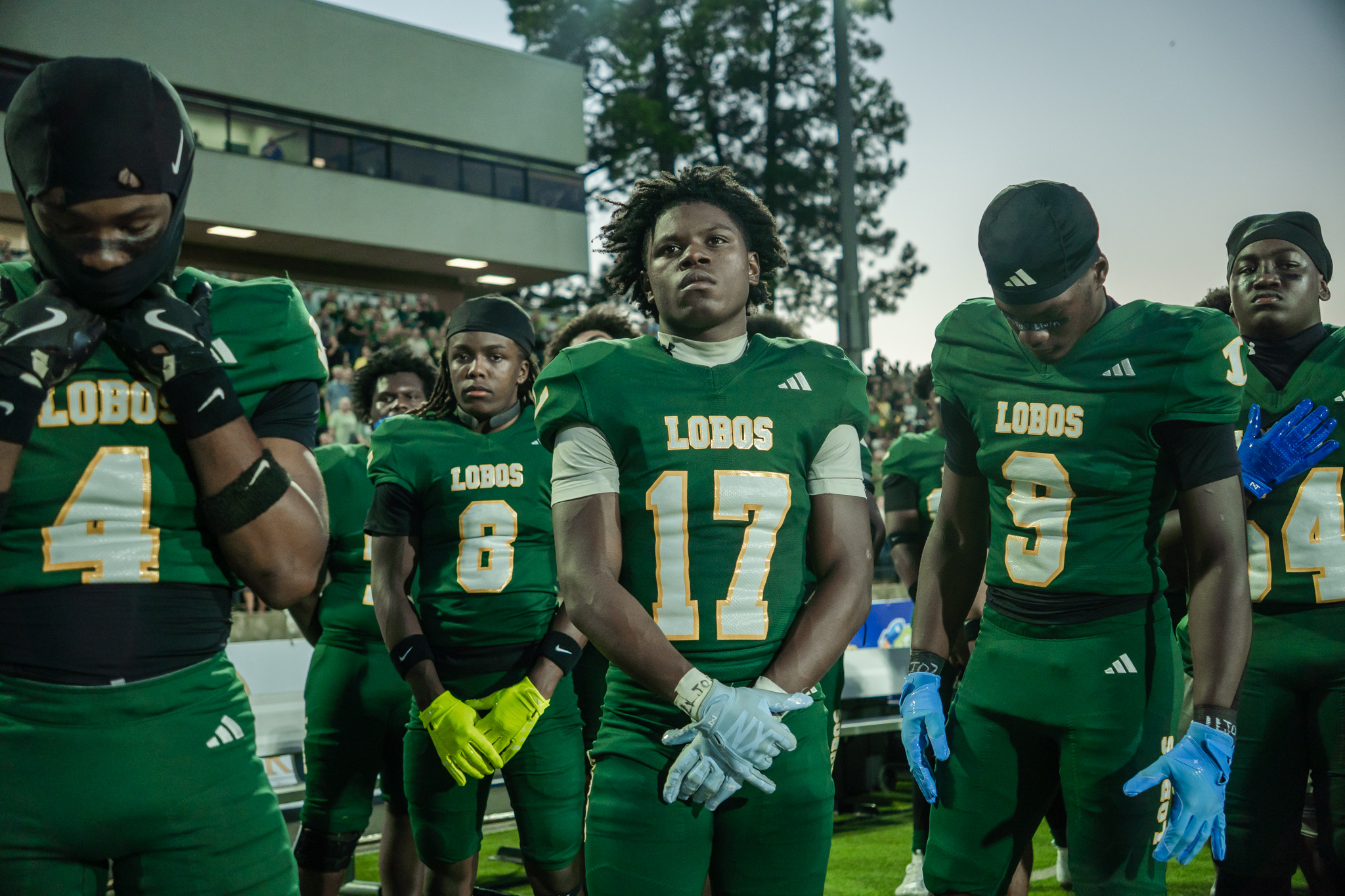 Longview player number 17 surrounded by teammates before the game